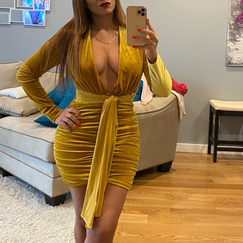 Miss Circle Velvet Omari’s Gold open front mini dress.